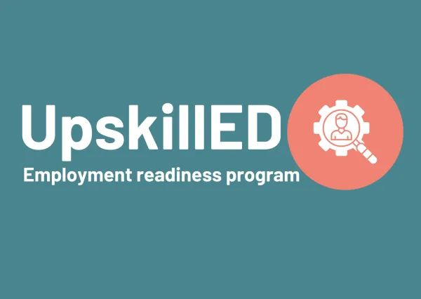 UpskillED UpskillED employment readiness program on a dark green blue background with an orange circle adjacent and in the middle is a magnifying glass