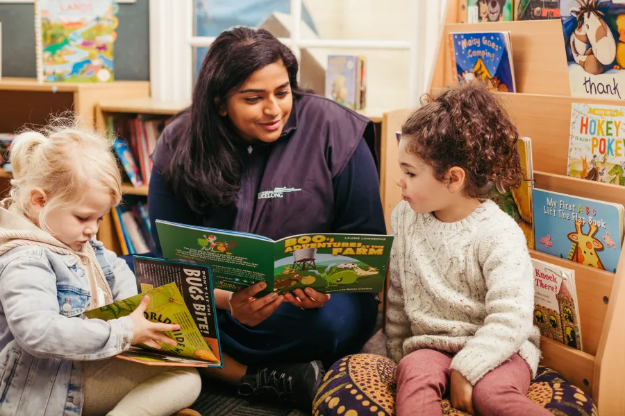 Family_Day_Services.jpg Educator reading to child at Early Childhood education centre.