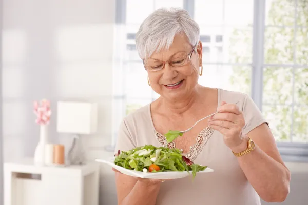 meals-on-wheels.jpeg Happy lady eating fresh meal.