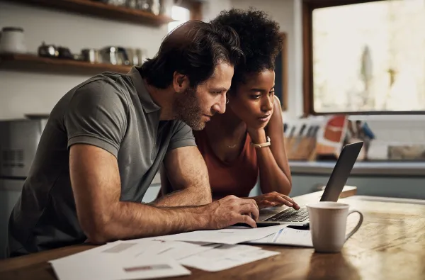 rates 2.jpeg Couple looking at rates on laptop