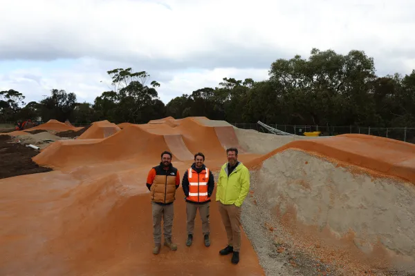 World Trail's Dylan Jefferies and Hamish McCallum-Smith with the City's Alistair Bain. Three men standing on a jump park