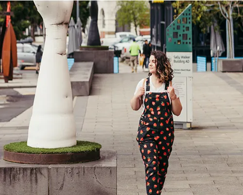 person walking in outdoor public space Person walking in outdoor public space