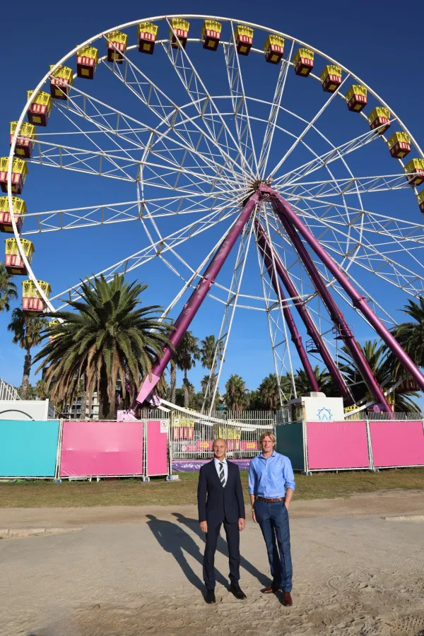 Mayor Stretch Kontelj and Brandon Verfurth in front of the Giant Sky Wheel at the waterfront. Greater Geelong Mayor Stretch Kontelj is standing with Giant Sky Wheel and café and Waterfront Train operator Brandon Verfurth in front of the Giant Sky Wheel at the waterfront.