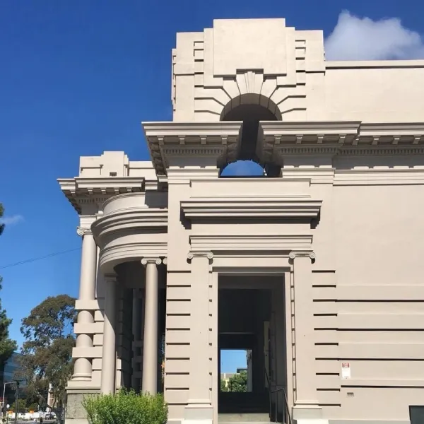 War Memorial Cream coloured facade of heritage building with blue sky behind