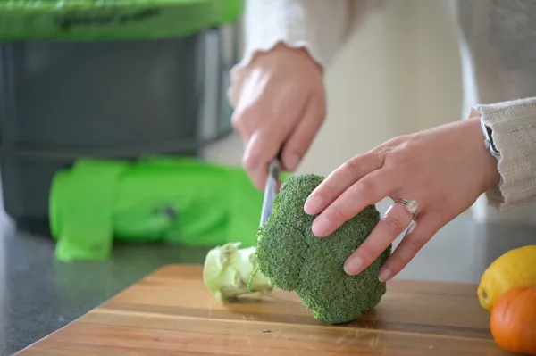 The Outpost provides fresh and healthy meals Woman cutting vegetables to make a meal