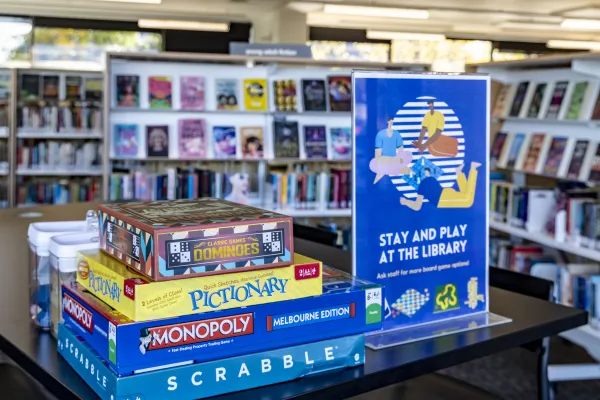 Modern libraries deliver far more than books, with free access to technology, digital literacy support, learning opportunities, programs, employment resources, connection and safe spaces. A stack of board games at a library