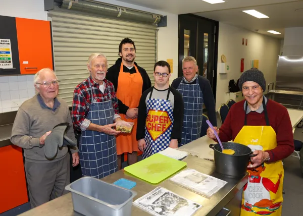 Men's Kitchen cooking class at Vines Road Community Centre. A group of men standing in a kitchen