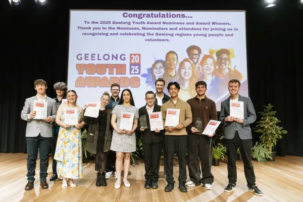 2025 Geelong Youth Awards winners Young people standing on a stage holding certificates and smiling