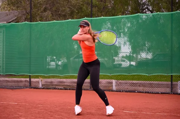Professional tennis player Amy Stevens in action. Amy Stevens in action