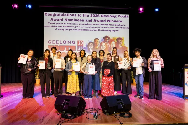 Winners with Councillors Sinclair and Cadwell and Christine Couzens MP. Credit - Lucinda Goodwin. Young people and adults standing on a stage smiling.