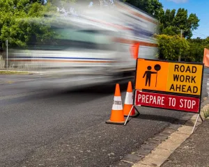 Road works sign with moving traffic Roads And Streets - Parking options in Central Geelong