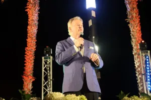 Denis Walter will host a milestone Carols by the Bay in 2026 Denis Walter on stage