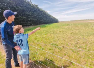 Ocean Grove Soccer Club president Peter Wilkinson and son Freddy look out across future Devlins Road soccer precinct. Peter and Freddy Wilkinson look out across future Devlins Road soccer precinct.